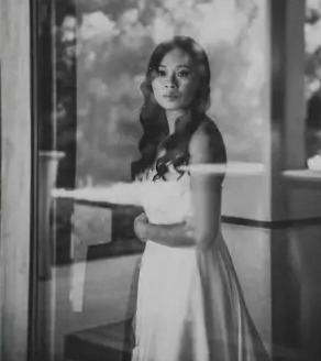 Bride in window light, black and white